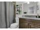 Bathroom with neutral-tone walls, and a decorative hanging shelf at 3173 Wake Up Ct, Kissimmee, FL 34744