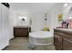 Bright bathroom featuring jacuzzi tub and decorative fixtures at 3173 Wake Up Ct, Kissimmee, FL 34744