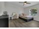 Bright bedroom featuring modern decor, a ceiling fan and natural light at 3173 Wake Up Ct, Kissimmee, FL 34744