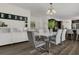 Elegant dining area featuring a modern table, sleek chairs, and contemporary lighting at 3173 Wake Up Ct, Kissimmee, FL 34744