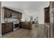 Spacious kitchen features stainless appliances, granite countertops, tile backsplash and wood cabinets at 3173 Wake Up Ct, Kissimmee, FL 34744