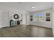 Bright living area featuring modern furniture, stylish decor, and ample natural light at 3173 Wake Up Ct, Kissimmee, FL 34744