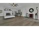 Well-lit living room featuring a fireplace, modern furniture, and contemporary decorations at 3173 Wake Up Ct, Kissimmee, FL 34744
