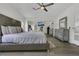Bright main bedroom with mirrored closet doors and stylish furniture at 3173 Wake Up Ct, Kissimmee, FL 34744