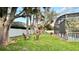 View of the backyard including a lawn, play set, and chairs near the enclosed pool at 3901 Ballinore Pl, Gotha, FL 34734