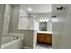 Bright bathroom featuring a bathtub and a wood vanity, offering a relaxing space at 3901 Ballinore Pl, Gotha, FL 34734