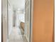 Long bathroom with closet, tile floors, tub and shower, and wooden vanity at 3901 Ballinore Pl, Gotha, FL 34734