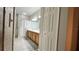Well-lit bathroom features a dual sink vanity, tile floors, and shower with tub at 3901 Ballinore Pl, Gotha, FL 34734