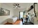 Cozy bedroom with hardwood floors, a ceiling fan, and a workspace with computer setup at 3901 Ballinore Pl, Gotha, FL 34734