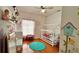 bedroom with hardwood floors, a rainbow decor, and a whimsical birdhouse design at 3901 Ballinore Pl, Gotha, FL 34734