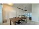 Neutral dining area featuring white walls, dark table, and a view of the couch and sliding glass door at 3901 Ballinore Pl, Gotha, FL 34734