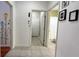 Hallway view of tiled flooring, white walls, and door frames at 3901 Ballinore Pl, Gotha, FL 34734