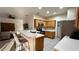 Well-lit kitchen with breakfast bar, stainless steel appliances, and wood cabinetry at 3901 Ballinore Pl, Gotha, FL 34734