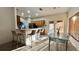 Bright kitchen with breakfast bar seating and a dining area with glass-top table at 3901 Ballinore Pl, Gotha, FL 34734