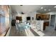 Inviting kitchen with breakfast bar seating, adjacent to a cozy living area and dining space at 3901 Ballinore Pl, Gotha, FL 34734