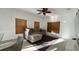 Cozy living room featuring a comfortable sectional sofa, ceiling fan, and natural lighting at 3901 Ballinore Pl, Gotha, FL 34734