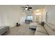 Open living area showcasing tile floors, living room seating, and a large dining room at 3901 Ballinore Pl, Gotha, FL 34734