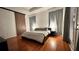 Light and airy main bedroom with hardwood floors and access to the outdoors at 3901 Ballinore Pl, Gotha, FL 34734