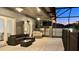 Patio area with couches, table, tv, and outdoor lights at 3901 Ballinore Pl, Gotha, FL 34734