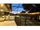 View of the pool with a childproof fence and outdoor lighting at 3901 Ballinore Pl, Gotha, FL 34734