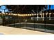 View of the pool with a childproof fence and outdoor lighting at 3901 Ballinore Pl, Gotha, FL 34734