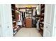 Organized walk-in closet with shelves, drawers, and ample space for clothing and accessories at 3901 Ballinore Pl, Gotha, FL 34734