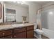This bathroom features a single sink vanity, tile flooring, and shower with curtain at 3991 Island Lakes Dr, Winter Haven, FL 33881