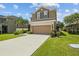 Charming two-story home with well-manicured landscaping, and double car garage with long driveway at 3991 Island Lakes Dr, Winter Haven, FL 33881