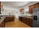 Spacious kitchen with sleek granite countertops, stainless steel appliances, and abundant cabinet storage at 3991 Island Lakes Dr, Winter Haven, FL 33881