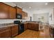 Well-equipped kitchen with granite countertops, stainless steel appliances, and seamless access to the dining area at 3991 Island Lakes Dr, Winter Haven, FL 33881