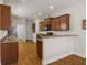 Modern kitchen features dark wood cabinets, granite countertops, and a breakfast bar for casual dining at 3991 Island Lakes Dr, Winter Haven, FL 33881