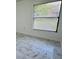 Well-lit bedroom with large windows, modern tile floors and ample space at 406 Long Dr, Kissimmee, FL 34759