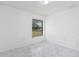 Bedroom featuring marble-look tile flooring and a bright window at 406 Long Dr, Kissimmee, FL 34759