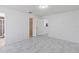 This bedroom features sleek marble-look tile flooring and a bathroom entrance at 406 Long Dr, Kissimmee, FL 34759