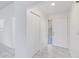 Bright entryway with marble-look floors and a coat closet at 406 Long Dr, Kissimmee, FL 34759