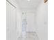 Bright entryway with marble-look floors and a coat closet at 406 Long Dr, Kissimmee, FL 34759