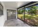 Covered patio with view of grassy yard and a sliding glass door at 406 Long Dr, Kissimmee, FL 34759