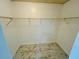 Large walk-in closet with tile floors and built-in shelving for optimal storage at 406 Long Dr, Kissimmee, FL 34759