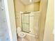 Bathroom with tiled shower and toilet at 4307 Creeks Run Blvd, Kissimmee, FL 34746