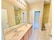 Bathroom featuring a double sink vanity and a shower at 4307 Creeks Run Blvd, Kissimmee, FL 34746