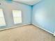 Bedroom featuring carpet and large window at 4307 Creeks Run Blvd, Kissimmee, FL 34746