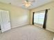 Bedroom featuring carpet and a bright window at 4307 Creeks Run Blvd, Kissimmee, FL 34746