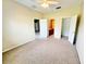 Bedroom featuring neutral carpet and multiple entryways at 4307 Creeks Run Blvd, Kissimmee, FL 34746