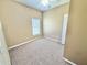 Bright bedroom with neutral walls, beige carpeting, white trim, and a ceiling fan at 4307 Creeks Run Blvd, Kissimmee, FL 34746