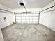 Spacious garage with concrete floor, Chamberlain garage door opener and plenty of room for storage at 4307 Creeks Run Blvd, Kissimmee, FL 34746