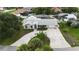An aerial view of a well maintained home with a circular driveway at 4407 Lake Trudy Dr, St Cloud, FL 34769