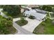 A beautiful home with a circular driveway, lush landscaping and mature trees at 4407 Lake Trudy Dr, St Cloud, FL 34769
