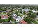 Neighborhood aerial view showcasing lush greenery, a nearby lake, and screened pools at 4407 Lake Trudy Dr, St Cloud, FL 34769