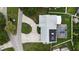 An aerial view of a well-maintained home with solar panels and screened pool at 4407 Lake Trudy Dr, St Cloud, FL 34769