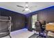 Bedroom featuring dark walls, gaming setup, and ceiling fan with LED lighting at 4407 Lake Trudy Dr, St Cloud, FL 34769